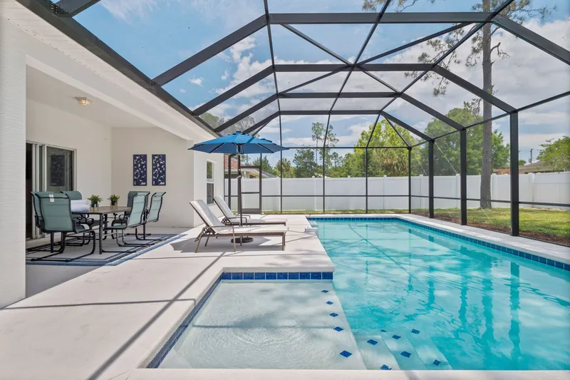Beautiful newly renovated home 4/2 with Fenced yard Heated Pool Pets welcome “WHISPERING PALM”